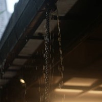 rainwater flows into chains and gutters - garden decoration stock pictures, royalty-free photos & images