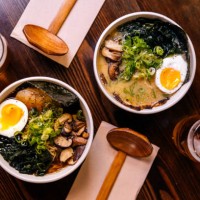 ramen soup served at the restaurant, directly above view - food fotografías e imágenes de stock