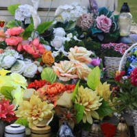 random flower bouquets left at the memorial site - garden decoration stock pictures, royalty-free photos & images