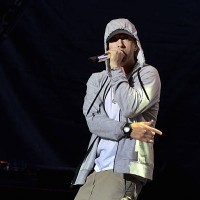Rapper Eminem performs on August 22, 2013 during a concert at the Stade de France in Saints-Denis, near Paris. AFP PHOTO / PIERRE ANDRIEU