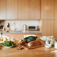 raw food and ingredients on kitchen island at home - food stock pictures, royalty-free photos & images