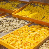 raw homemade conchiglie pasta on street in italy. traditional food. bari. - food stock pictures, royalty-free photos & images