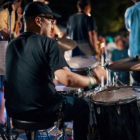 rear view of a drummer at a outdoor music festival - concert stock pictures, royalty-free photos & images