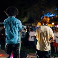 rear view of a music group playing a live concert at an outdoor music festival - concert stock pictures, royalty-free photos & images
