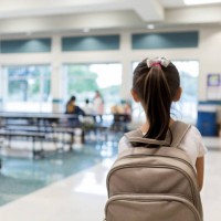 rear view of young schoolgirl entering cafeteria - food stock pictures, royalty-free photos & images