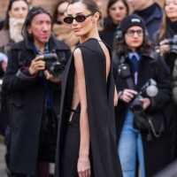 Rebecca Donaldson wears black sunglasses, black sleeveless cutout maxi dress, outside Sportmax, during the Milan Fashion week Women's Fall/Winter...