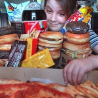 Rebecca Payne of Brookline in awash in junk food at her home. Staff Photo Michael fein saved in advance news and photo2