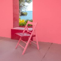 red chair with the mediterranean sea view and red architecture. - garden decoration stock pictures, royalty-free photos & images