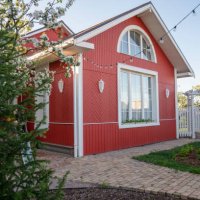 red house with string lights by trees in back yard - garden decoration stock pictures, royalty-free photos & images