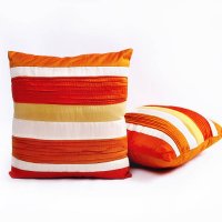 red orange and white throw pillows on a white background - home decoration stock pictures, royalty-free photos & images