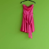 red suit and shoes against a green wall - fashion stock pictures, royalty-free photos & images
