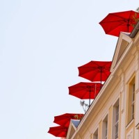 red umbrellas on a roof terrace, potsdam, brandenburg, germany - garden decoration stock pictures, royalty-free photos & images