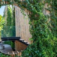 reflect mirror and ivy growth cover bamboo wall - garden decoration stock pictures, royalty-free photos & images