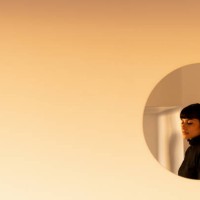 reflection of a young woman on a round mirror by the wall - fashion stock pictures, royalty-free photos & images