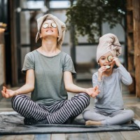 relaxed mother and daughter exercising yoga in the morning at home. - food stock pictures, royalty-free photos & images