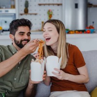 relaxed weekend at home and ordering food - junk food stock pictures, royalty-free photos & images