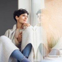 relaxed woman at home sitting at the window - home decoration stock pictures, royalty-free photos & images