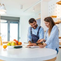 repairman gives repair estimate to a woman - home decoration stock pictures, royalty-free photos & images