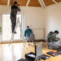 repairman professionals working in client's home - home decoration stock pictures, royalty-free photos & images