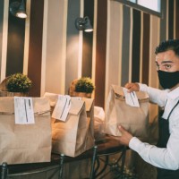 restaurant employer prepairing packed food for taking away. reopening after covid-19 quarantine concepts. - junk food stock pictures, royalty-free photos & images