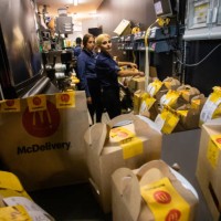 Restaurant workers packing orders for delivery during McDonald’s reopening on September 20, 2022 in Kyiv, Ukraine. McDonald’s reopens the first three...