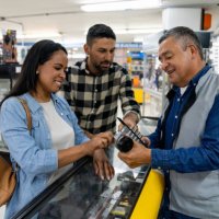 retail clerk helping a couple shopping at a hardware store - home decoration stock pictures, royalty-free photos & images