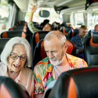 retired tourists in 60s and 70s onboard motor coach - travel stock pictures, royalty-free photos & images