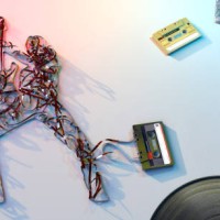 retro 1980s cassette tape spilling forming rock star holding guitar - home decoration stock pictures, royalty-free photos & images