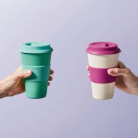 reusable coffee cup in hand - junk food stock pictures, royalty-free photos & images