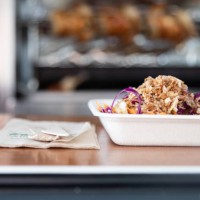 roast chicken and salad on biodegradable paper plate on food truck counter - junk food stock pictures, royalty-free photos & images