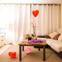 romantic picture of a helium red balloon with heart shape flying in the home during valentine's day. - home decoration stock pictures, royalty-free photos & images