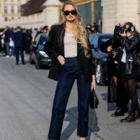 Romee Strijd wears black blazer, white shirt, denim jeans, black bag, sunglasses outside Dior during the Womenswear Fall/Winter 2024/2025 as part of...
