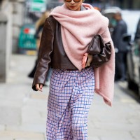 Rosana Lai wears pink scarf, checkered pink skirt, brown leather jacket outside Simone Rocha during London Fashion Week September 2024 on September...