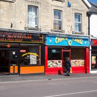Row of fast food take-away restaurant shops, Chippenham, Wiltshire, England, UK.