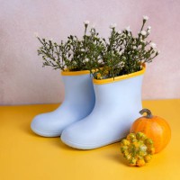 rubber blue boots with white flowers in.pumpkins near them,good as autumn backround. - garden decoration stock pictures, royalty-free photos & images