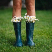 rubber boots with beautiful field flowers in garden. copy space for text - garden decoration stock pictures, royalty-free photos & images