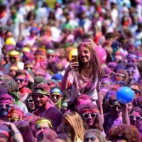 Runners attend a DJ concert after finishing the Burdi Colors race on May 5, 2018 in Pessac, southwestern France. The Burdi Colors is a 5 km race with...