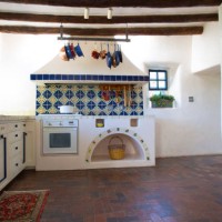 rustic southwest usa kitchen: brick floor, beams, oven, counters - home decoration stock pictures, royalty-free photos & images