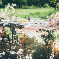 rustic wooden table with elegant festive setting decorated with fresh pastel aromatic flowers. - garden decoration stock pictures, royalty-free photos & images