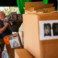 Sam Love unpacks Beyoncé merchandise as fans line up before the artists two weekend concerts at NRG Stadium, Saturday, Sept. 23 in Houston.
