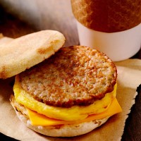 sausage and egg breakfast sandwich - junk food stock pictures, royalty-free photos & images