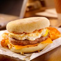 sausage and egg breakfast sandwich at your desk - junk food stock pictures, royalty-free photos & images