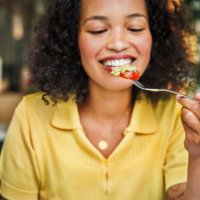 savoring a fresh salad bite - food stock pictures, royalty-free photos & images