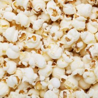 scattered popcorn texture background - food stock pictures, royalty-free photos & images
