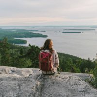 scenic view of woman looking at lake in finland - travel stock pictures, royalty-free photos & images
