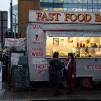 School children waiting outside a fast food bar at Aldgate on 26th November 2019 in London, England, United Kingdom. Eating fast food has been linked...