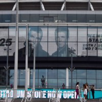 Screens at Wembley Stadium advertise the forthcoming gigs by Oasis, currently scheduled to play five nights in July and August 2025 at the famous...