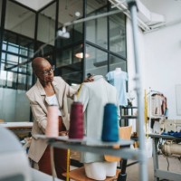 seamstress in the stylist sewing studio - fashion stock pictures, royalty-free photos & images