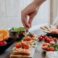 seasoning tasty bruscheta in the kitchen - food stock pictures, royalty-free photos & images