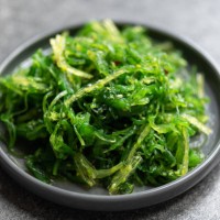 seaweed salad in black plate - food stock pictures, royalty-free photos & images